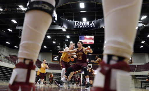 Loyola center Cameron Krutwig, right, works with forward Nick DiNardi during NCAA college basketball practice in Chicago, Friday, March 9, 2018. Loyola locks up 1st March Madness appearance in 33 years. (AP Photo/Nam Y. Huh)