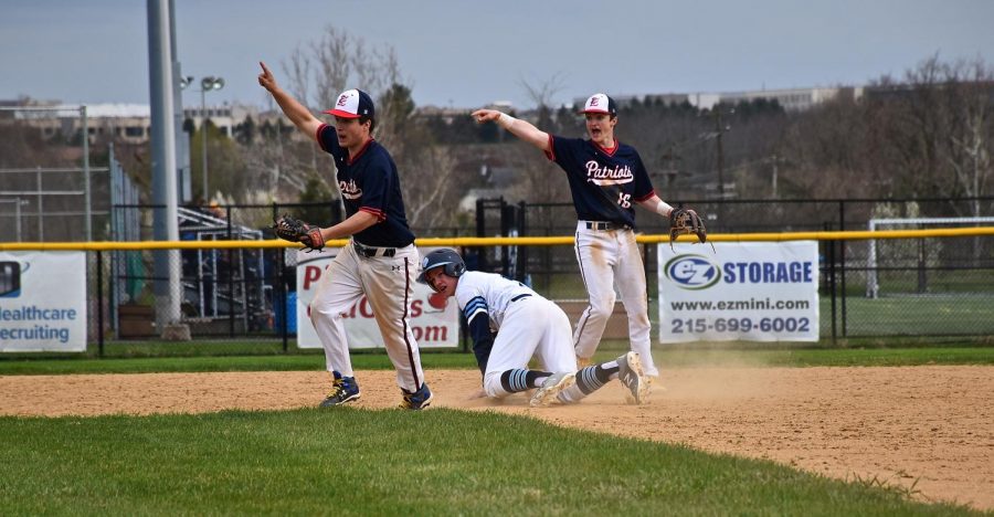 BASEBALL- Senior Connor Mikulski dives into second and is called safe.