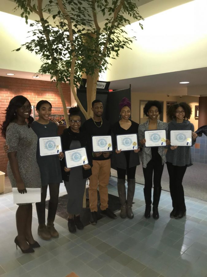 Tyreck Kelly and the rest of the African American Awareness Club executive board members show off their outstanding achievements granted by the school board.