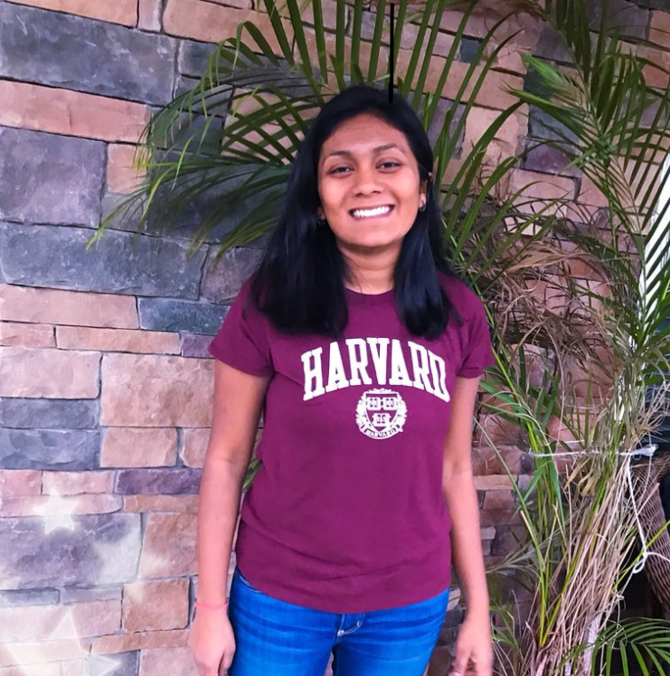 Valedictorian Palak Shah poses for a picture wearing her college shirt