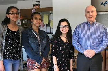 Divya Sood, Aliana Vicens, and Rachel Rubins stand with Drew McGinty following a meeting with the North Penn Democrats Club at North Penn High School.