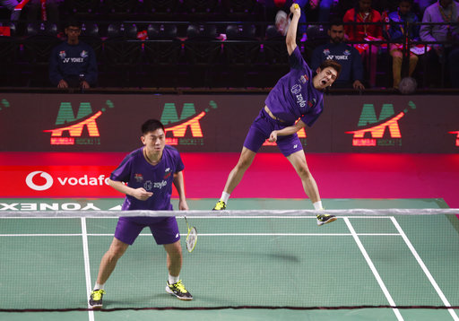 Korean badminton player Lee Long Dae, right, and Malaysian badminton player Tan Boon Heong of Mumbai Rockets play against Indian badminton player B Sumeeth Reddy and Taiwans badminton player Polish Lee Yang of Chennai Smashers during the Vodafone Premier Badminton League mixed doubles match in New Delhi, India, Wednesday, Dec. 27, 2017. Mumbai Rockets won the match by 15-9, 15-6. (AP Photo/Altaf Qadri)