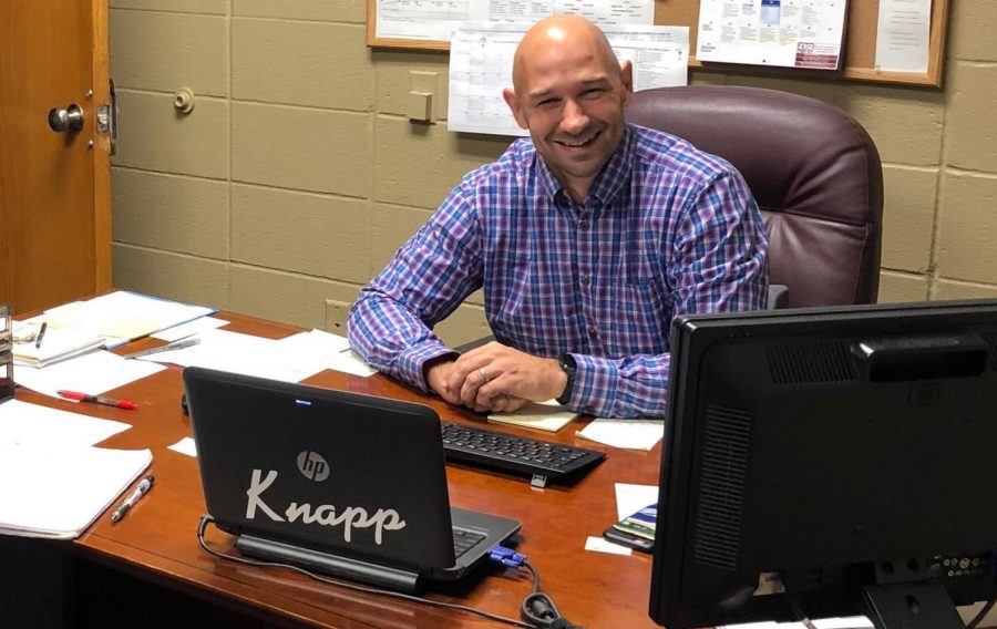 MULLING OVER HIS NEW SCHOOL: Mr. Stefan Muller ease into his new position as principal at Knapp Elementary School 
