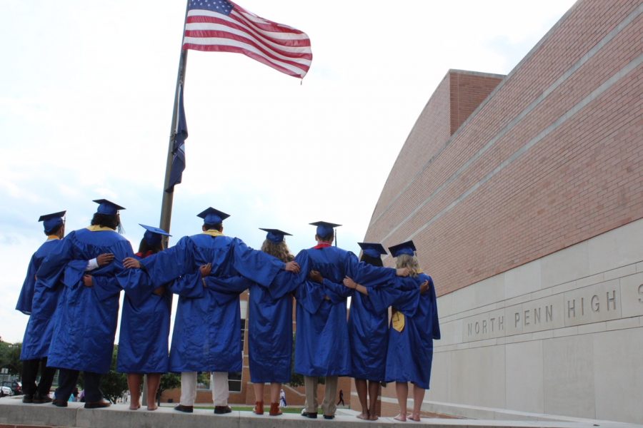 A group of 2018 NPHS graduates stand together following the graduation ceremony.