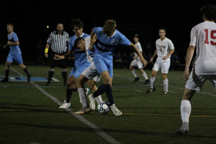 Senior Jared Huzar dribbles his way out of a clogged center into open space. 