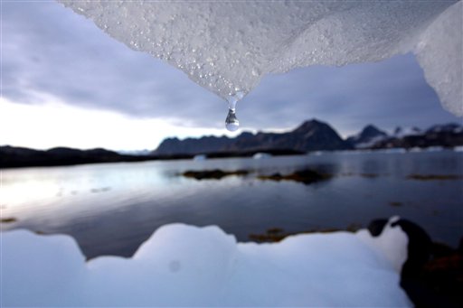 ** FILE ** An iceberg melts in Kulusuk, Greenland near the arctic circle Tuesday Aug, 16, 2005. Unchecked global warming will devastate the world economy on the scale of the world wars and the Great Depression, a British government report said Monday Oct 30 2006, as the country launched a bid to convince doubters that environmentalism and economic growth can coincide. Sir Nicholas Stern, the senior government economist who wrote the report, said that acting now to cut greenhouse gas emissions would cost about 1 percent of global GDP each year. (AP Photo/John McConnico)