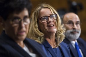 UNITED STATES - SEPTEMBER 27: Christine Blasey Ford, center, flanked by attorneys Debra Katz and Michael Bromwich, testifies during the Senate Judiciary Committee hearing on the nomination of Brett M. Kavanaugh to be an associate justice of the Supreme Court of the United States, focusing on allegations of sexual assault by Kavanaugh against Christine Blasey Ford in the early 1980s. ((Tom Williams/Pool Photo via AP)