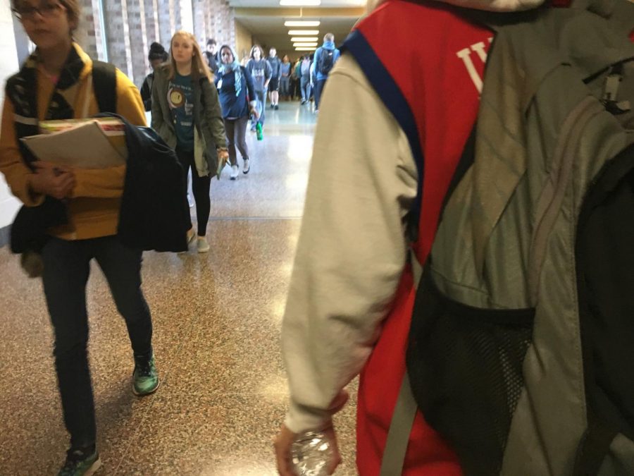 NPHS students make their way through backpack to backpack traffic during passing time.