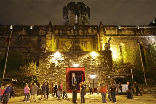 In this Friday, Sept. 27, 2013 photo, Eastern State Penitentiary in Philadelphia is illuminate for its Halloween haunted house Terror Behind the Walls at Eastern State Penitentiary in Philadelphia. The penitentiary took in its first inmate in 1829, closed in 1971 and reopened as a museum in 1994. (AP Photo/Matt Rourke)