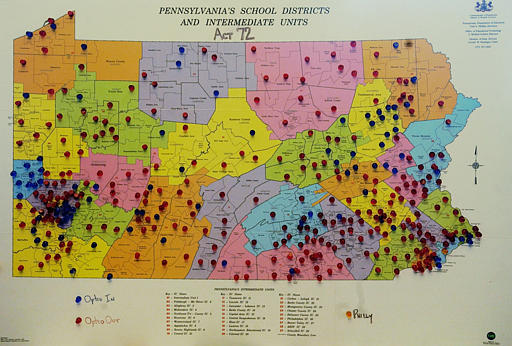 A pin-dotted map of Pennsylvania is seen in Harrisburg, Pa., Thursday, May 26, 2005, showing the breadth of school districts opposition to the Act 72 property-tax relief program. Red pins sweep the state, denoting districts whose boards refuse to participate in the program. Blue pins denote where boards have opted in. (AP Photo/Carolyn Kaster)