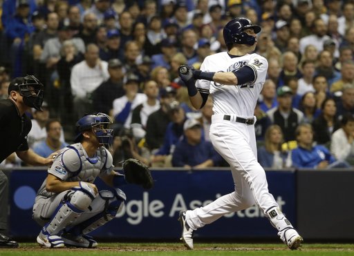 Milwaukee Brewers Christian Yelich hits a home run during the first inning of Game 7 of the National League Championship Series baseball game against the Los Angeles Dodgers Saturday, Oct. 20, 2018, in Milwaukee. (AP Photo/Matt Slocum)
