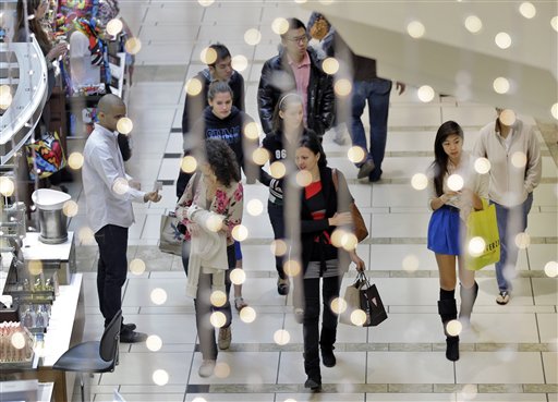 Shoppers walk through the International Mall Friday, Nov. 23, 2012, in Tampa, Fla. Black Friday, the day when retailers traditionally turn a profit for the year, actually got a jump start this year as many stores opened just as families were finishing up Thanksgiving dinner. Stores are experimenting with ways to compete with online rivals like Amazon.com that can offer holiday shopping deals at any time and on any day.(AP Photo/Chris OMeara)