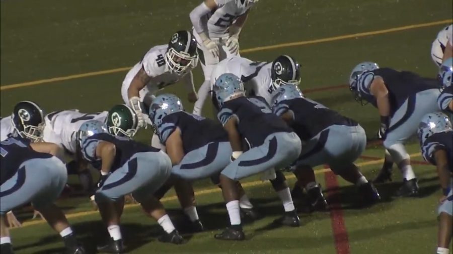 Knights QB Solomon Robinson under center right before the snap.