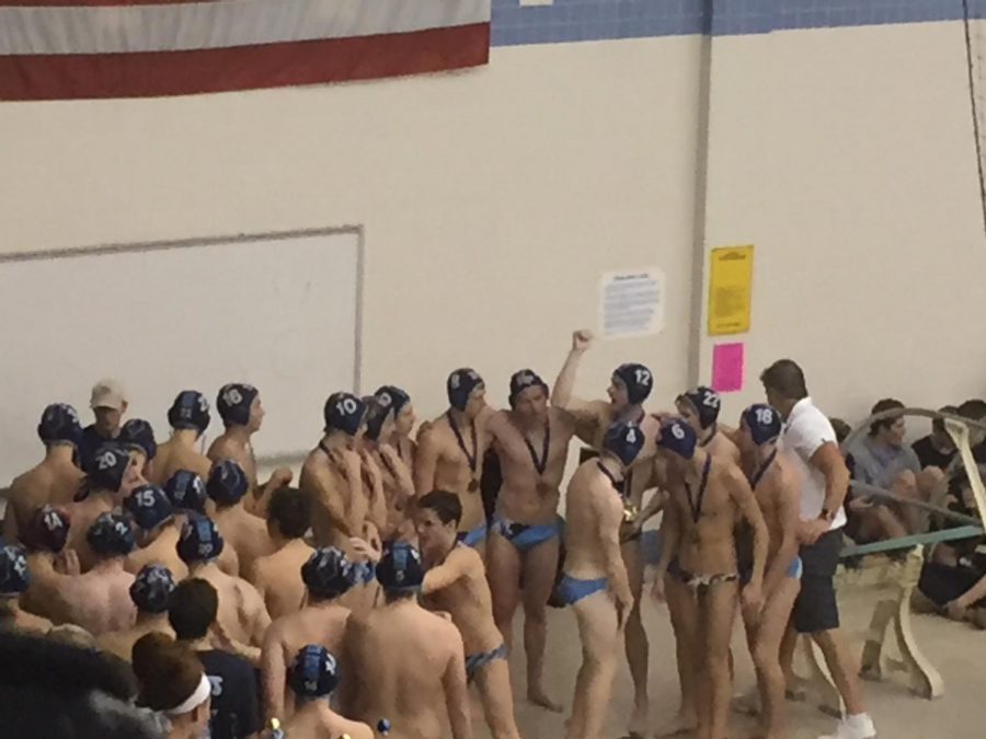 The+boys+water+polo+team+celebrates+after+winning+their+second+straight+state+title.