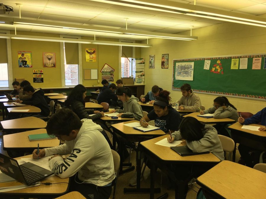 MATH COUNTS: Students in Mr. Chris Cummiskeys AP Statistics course at North Penn High School work during a recent class period. Many NPHS students thrive in advanced level courses, but the time and effort is certainly a challenge.  