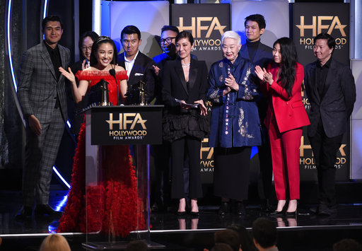 Constance Wu and the cast of Crazy Rich Asians accepts the Hollywood breakout ensemble award at the Hollywood Film Awards on Sunday, Nov. 4, 2018, at the Beverly Hilton Hotel in Beverly Hills, Calif. Pictured from left are Henry Golding, Jimmy O. Yang, Ronny Chieng, Nico Santos, Michelle Yeoh, Lisa Lu, Harry Shum Jr., Awkwafina and Ken Jeong. (Photo by Chris Pizzello/Invision/AP)