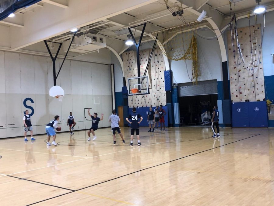 The boys basketball team practices before their season gets underway