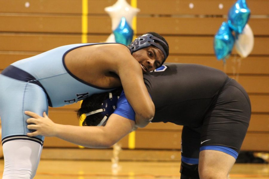 Amir Pickens wrestles for the final win of the match. 