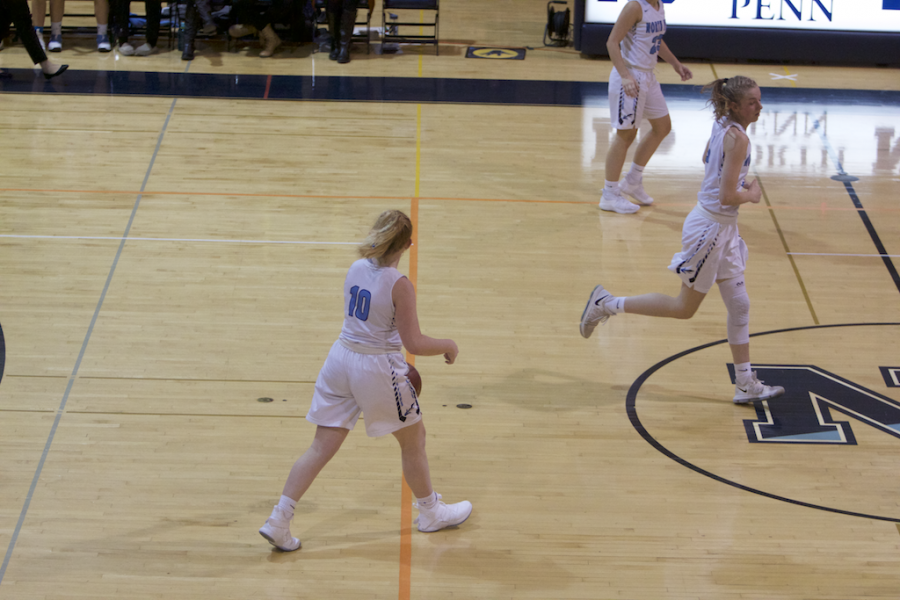 Sophomore Laynie Doran dribbles down the court for the Knights.