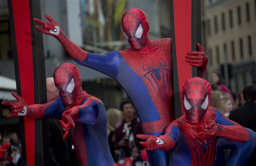 Costumed performers wearing Spiderman costumes, arrive for the World premiere of The Amazing Spiderman 2, at a central London cinema in Leicester Square, Thursday, April 10, 2014. (Photo by Joel Ryan/Invision/AP)