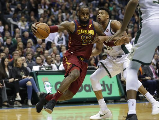 Cleveland Cavaliers LeBron James drives past Milwaukee Bucks Giannis Antetokounmpo during the first half of an NBA basketball game Tuesday, Dec. 19, 2017, in Milwaukee. (AP Photo/Morry Gash)