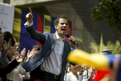 In this Jan. 11, 2019 photo, Juan Guaido, President of the Venezuelan National Assembly delivers a speech during a public session with opposition members, at a street in Caracas, Venezuela. The head of Venezuelas opposition-run congress says that with the nations backing hes ready to take on Nicolas Maduros presidential powers and call new elections.(AP Photo/Fernando Llano)