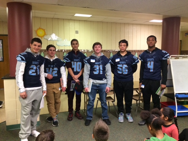 The North Penn Knights pose for a picture at Gwynedd Square Elementary, one of the 13 schools where they read to elementary schoolers for the 15th year in a row.