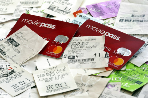 Movie Pass debit cards and used movie tickets are shown in this photo, in New York, Thursday, Aug. 23, 2018. (AP Photo/Richard Drew)