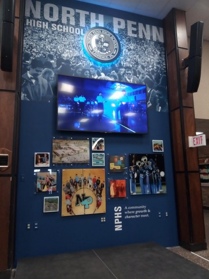 After removing the map in the front lobby, North Penn administration has replaced the wall with a TV, speakers, and moving picture frames to increase the focus on student life.