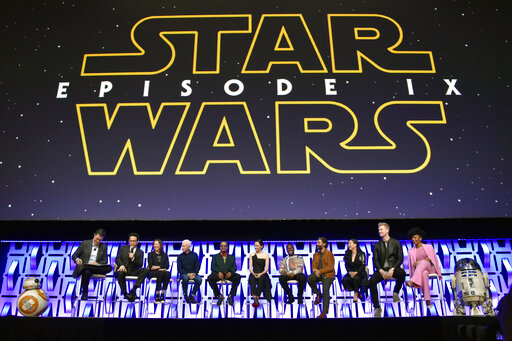 Stephen Colbert, from left, J.J. Abrams, Kathleen Kennedy, Anthony Daniels, Billy Dee Williams, Daisy Ridley, John Boyega, Oscar Isaac, Kelly Marie Tran, Joonas Suotamo and Naomi Ackie participate in the Star Wars: The Rise of Skywalker panel on day 1 of the Star Wars Celebration at Wintrust Arena on Friday, April 12, 2019, in Chicago. (Photo by Rob Grabowski/Invision/AP)