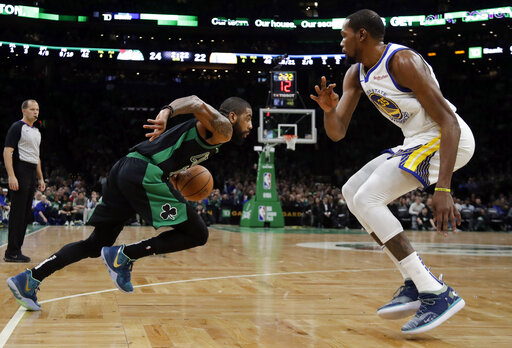 Boston Celtics guard Kyrie Irving (11) drives against Golden State Warriors forward Kevin Durant, right, in the first quarter of an NBA basketball game, Saturday, Jan. 26, 2019, in Boston. (AP Photo/Elise Amendola)