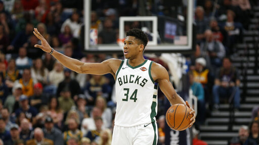 Milwaukee Bucks forward Giannis Antetokounmpo (34) brings the ball up court in the second half during an NBA basketball game against the Utah Jazz Saturday, March 2, 2019, in Salt Lake City. (AP Photo/Rick Bowmer)