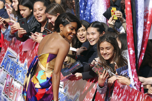 Gabrielle Union takes selfies with the fans as she arrives at the Americas Got Talent Season 14 Kickoff at the Pasadena City Auditorium on Monday, March 11, 2019, in Pasadena, Calif. (Photo by Willy Sanjuan/Invision/AP)