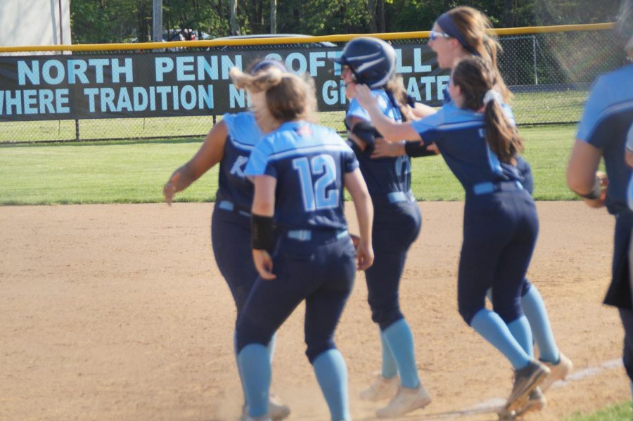 The Knights celebrate with Jordan Pietrzykoski after her walk-off hit.