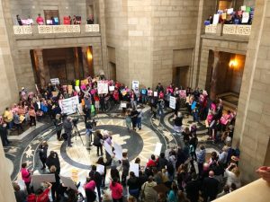 Supporters of abortion rights rally against recently passed restrictions on abortions in the Statehouse rotunda Tuesday, May 21, 2019, at the Nebraska Capitol in Lincoln, Nebraska. More than 350 people filled the Capitol as part of a national campaign to build momentum for their cause in the 2020 election. (AP Photo/Grant Schulte)