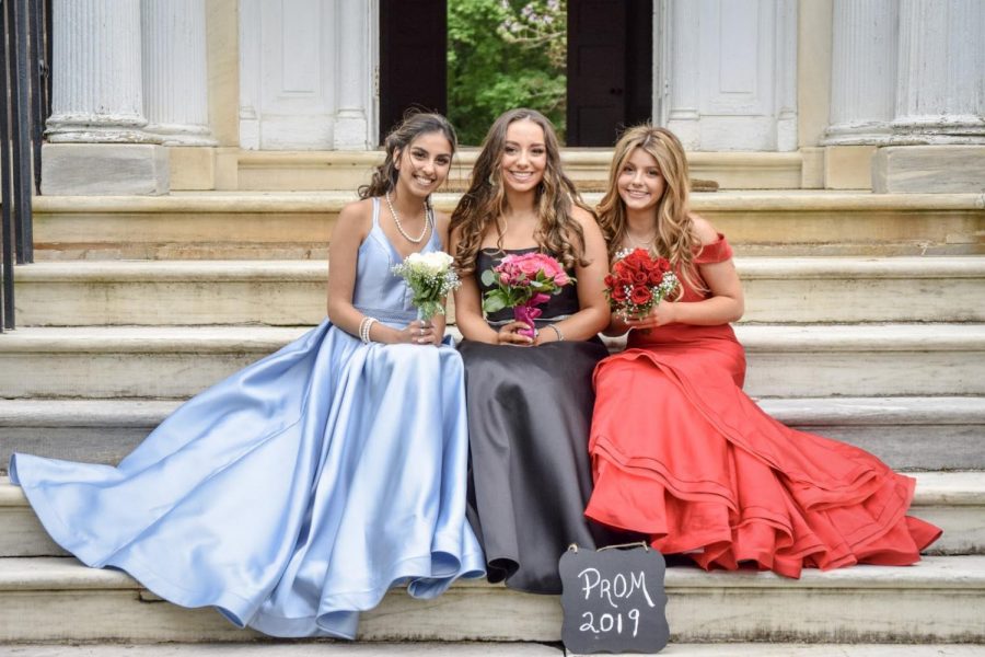 Seniors Natasha Camblin, Gabrielle Salvino, and Shannon Mullen posing at The Highlands for some prom pictures.
