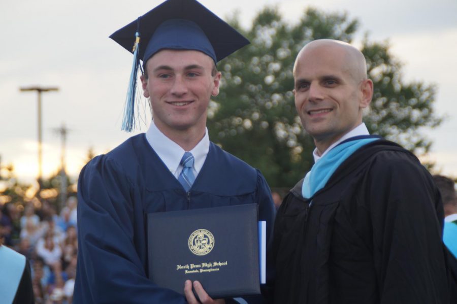 Aidan+Sullivan+shakes+hands+with+principal+Pete+Nicholson+during+the+2019+commencement+ceremony+at+North+Penn+High+School.+