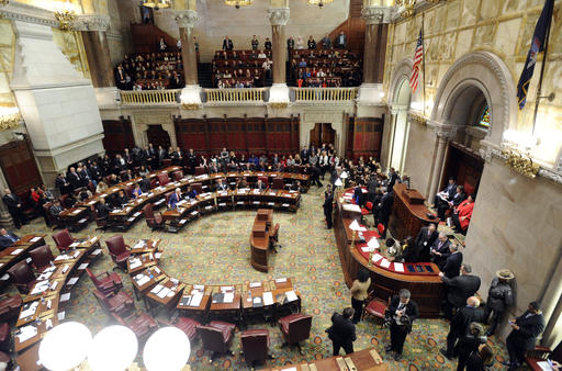 Members of New York states Electoral College sign documentation after voting for president in the Senate Chamber of the Capitol in Albany, N.Y., Monday, Dec. 19, 2016. (AP Photo/Hans Pennink via AP,Pool)