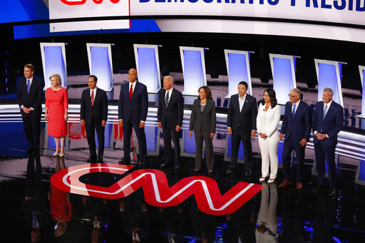 Sen. Michael Bennet, D-Colo., from left, Sen. Kirsten Gillibrand, D-N.Y., former Housing and Urban Development Secretary Julian Castro, Sen. Cory Booker, D-N.J., former Vice President Joe Biden, Sen. Kamala Harris, D-Calif., Andrew Yang, Rep. Tulsi Gabbard, D-Hawaii, Washington Gov. Jay Inslee and New York City Mayor Bill de Blasio participate in the second of two Democratic presidential primary debates hosted by CNN, July 31, 2019, in the Fox Theatre in Detroit. (AP Photo/Paul Sancya)