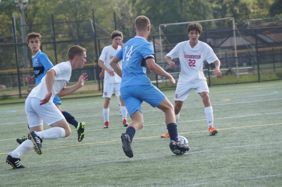 Carter Houlihan dribbles through the Souderton defenders.  He finished with 4 goals.