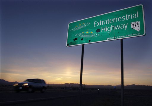 FILE - In this April 10, 2002, file photo, a car moves along the Extraterrestrial Highway near Rachel, Nev, the closest town to Area 51. The U.S. Air Force is giving an ultimatum to owners of the remote Nevada property: Take a $5.2 million last best offer by Thursday,, Sept. 10, 2015, for their property now surrounded by a vast bombing range including the super-secret Area 51, or the government will seize it. (AP Photo/Laura Rauch, File)