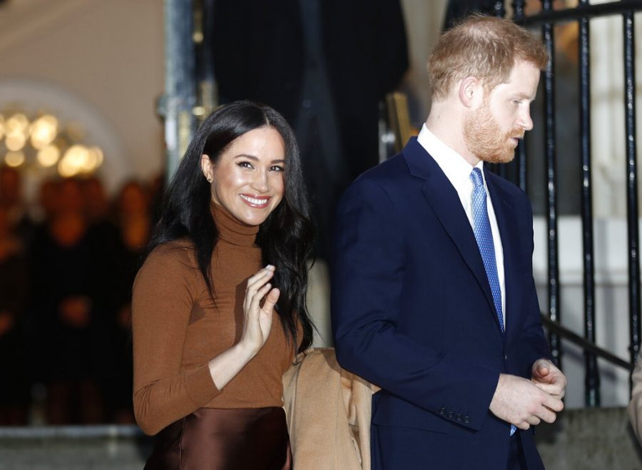 FILE - In this Jan. 7, 2020, file photo, Britains Prince Harry and Meghan, Duchess of Sussex leave after visiting Canada House in London, after their recent stay in Canada. Prince Harry and Meghan Markle are to no longer use their HRH titles and will repay £2.4 million of taxpayers money spent on renovating their Berkshire home, Buckingham Palace announced Saturday, Jan. 18. 2020. (AP Photo/Frank Augstein, File)