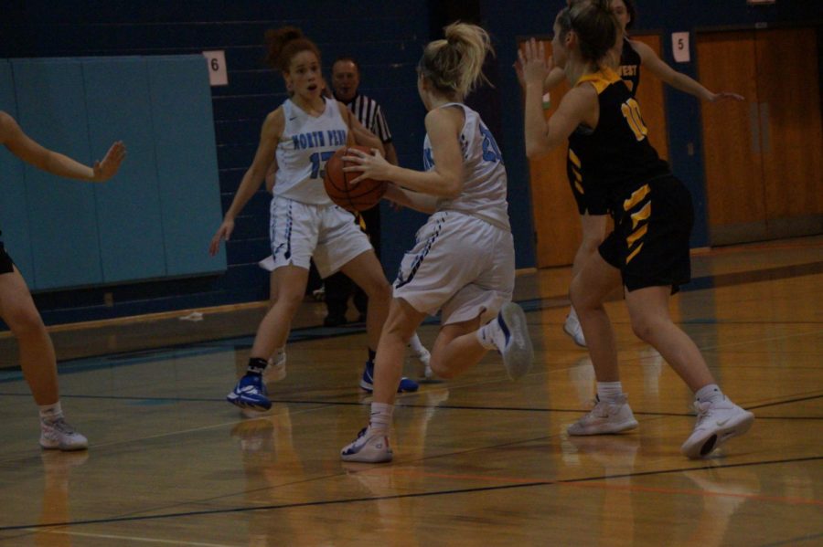 Alaina Mullaly drives to the basket for a layup.
