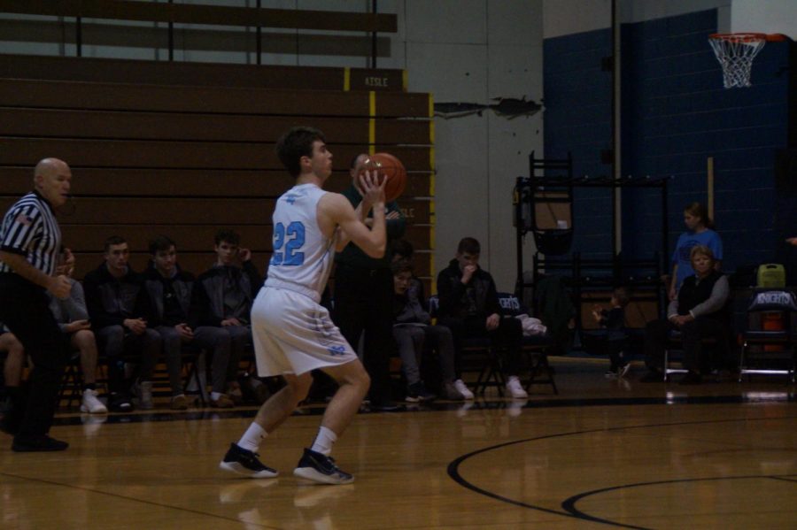 Mike Chaffee shoots a three-pointer in the first quarter against the Rams.