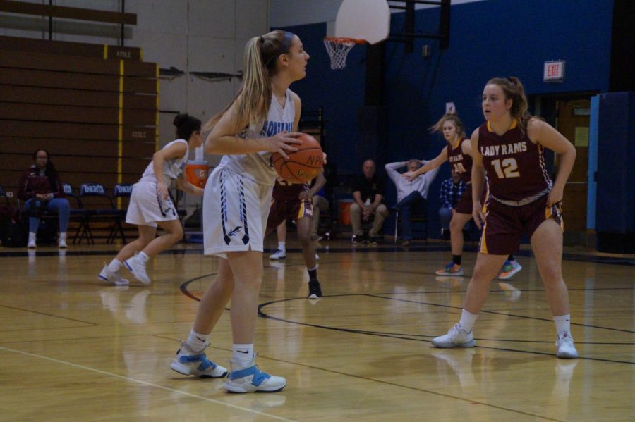 Point guard, Alli Lindsay, looking to pass the ball for the Knights