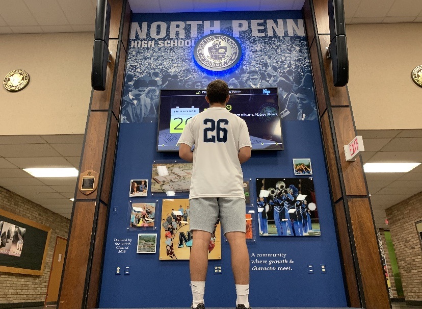 NPHS Sophomore Ben Barbosa ponders life in the NPHS auditorium lobby.