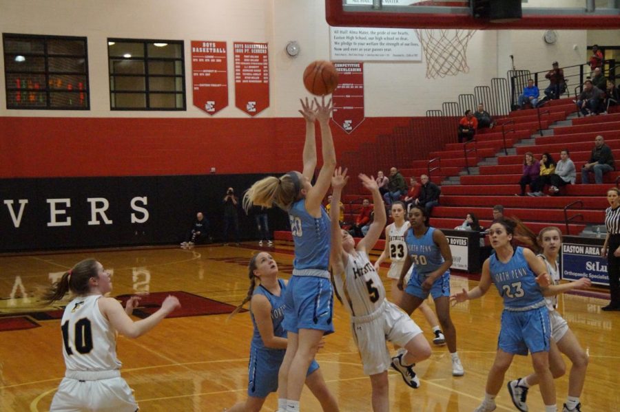 Crashing the Boards- Senior captain Alaina Mullaly hauls in a rebound for the Knights.