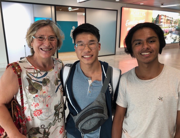 Heng (center) with his first host family at the airport.