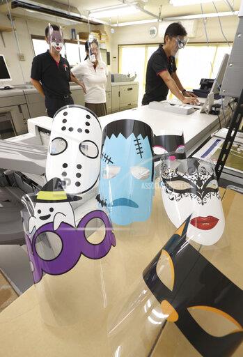 Face shields that featuring Halloween are manufactured at a printing company Handa in Niiza, Saitama Prefecture on Oct. 6, 2020. About 10 kinds of illustrations such as Frankenstein, ghost, animals are printed on face shields. I hope face shields make people feel safe and happy, Kiyomi Tsugawa, Handas president, said.  ( The Yomiuri Shimbun via AP Images )