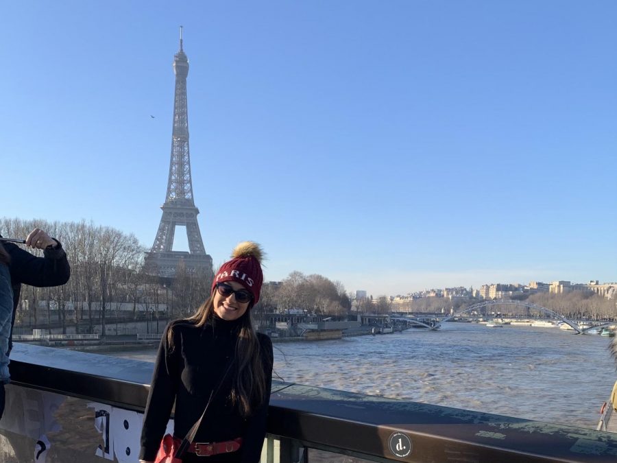 Chhugani posing for a photo in front of the Eiffel Tower when her family came to visit.